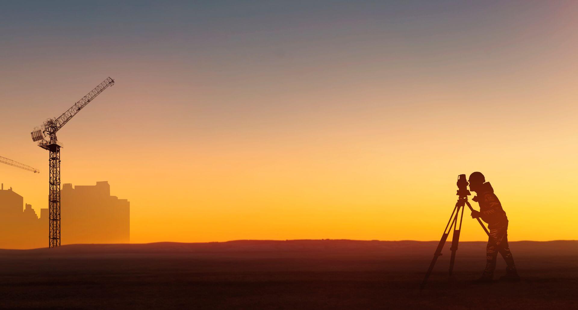 A land surveyor surveying a project in Modesto, CA