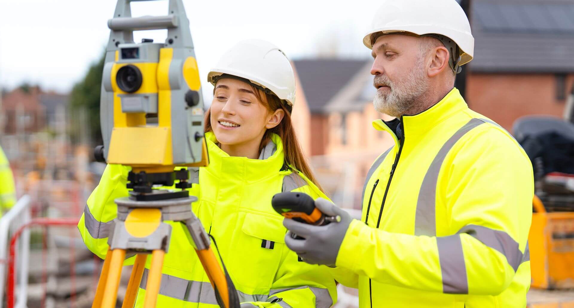 Two land surveyors working on a construction project in Modesto, CA