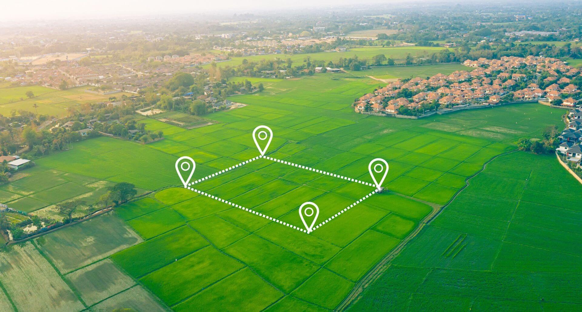 A piece of property with gps markers. The property is outlined in white dash marks.